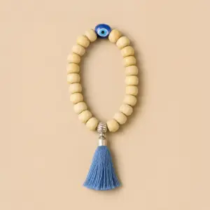 Pulsera Elástica de Madera con un ojo turco y borla